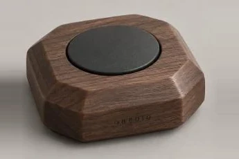 Faceted walnut form with engraved OBEDIO
